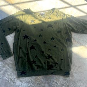 Green shirt with black stars